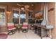 Inviting covered patio with ceiling fan, TV, and grill, perfect for relaxation and entertaining at 4216 E Desert Marigold Dr, Cave Creek, AZ 85331