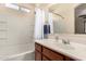 Bathroom featuring a vanity, bathtub, and shower with white tiling at 42578 W Rosalia Dr, Maricopa, AZ 85138