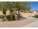 Single-story home featuring desert landscaping, a two-car garage, and classic Southwest architecture at 42578 W Rosalia Dr, Maricopa, AZ 85138