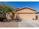 Charming single-story home features a desert landscape, two-car garage, and a classic Southwest design at 42578 W Rosalia Dr, Maricopa, AZ 85138