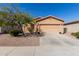 Charming single-story home with a two-car garage and well-maintained landscaping at 42578 W Rosalia Dr, Maricopa, AZ 85138