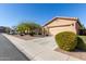 Lovely home featuring a two-car garage and appealing desert landscaping at 42578 W Rosalia Dr, Maricopa, AZ 85138