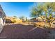 Spacious backyard featuring desert landscaping, a rock pathway, and mountain views in the distance at 4267 S Strong Box Rd, Gold Canyon, AZ 85118