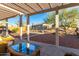 Inviting backyard patio with pergola and gravel landscape at 4267 S Strong Box Rd, Gold Canyon, AZ 85118