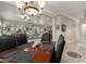 Dining area featuring an elegant chandelier and an open layout to the kitchen and living spaces at 4267 S Strong Box Rd, Gold Canyon, AZ 85118