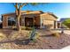 Charming single-story home featuring desert landscaping and a two-car garage in a sunny, tranquil neighborhood at 4267 S Strong Box Rd, Gold Canyon, AZ 85118