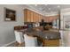 Kitchen with bar seating, and stainless steel appliances at 4267 S Strong Box Rd, Gold Canyon, AZ 85118