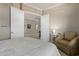 Bright bedroom with double doors leading to the hall and an ensuite bathroom at 4267 S Strong Box Rd, Gold Canyon, AZ 85118