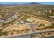 Community aerial view featuring a neighborhood park with playground, desert landscape, and mountain views at 4502 E Night Owl Ln, Cave Creek, AZ 85331