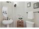 Charming powder room features a pedestal sink, decorative accents, and a warm, inviting ambiance at 4502 E Night Owl Ln, Cave Creek, AZ 85331