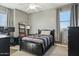 Cozy bedroom with a ceiling fan and ample natural light creating a relaxing space at 4502 E Night Owl Ln, Cave Creek, AZ 85331