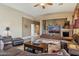 Spacious living room with a stacked stone fireplace, recessed lighting, and comfortable seating at 4502 E Night Owl Ln, Cave Creek, AZ 85331