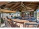 Outdoor bar with a built-in grill, bar seating, and a covered patio at 4502 E Night Owl Ln, Cave Creek, AZ 85331