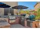 Outdoor kitchen with stainless steel appliances, a built-in grill, and ample counter space at 4502 E Night Owl Ln, Cave Creek, AZ 85331