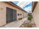 Cozy backyard with a small bench, rock landscaping, and stucco walls at 4683 W Dublin St, Chandler, AZ 85226