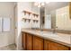 Bathroom with double sink vanity, tile floor, and large mirrors at 4683 W Dublin St, Chandler, AZ 85226