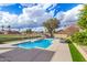 Community pool features clear blue water, lounge chairs, and manicured landscaping, perfect for relaxation at 4683 W Dublin St, Chandler, AZ 85226