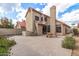 View of back exterior featuring an outdoor table and chairs, stucco wall and red tile roof at 4683 W Dublin St, Chandler, AZ 85226