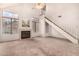 Bright living room featuring a fireplace, vaulted ceiling, carpet, and natural light at 4683 W Dublin St, Chandler, AZ 85226