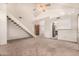 Spacious living room with vaulted ceiling, staircase, and view into the kitchen at 4683 W Dublin St, Chandler, AZ 85226