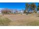 Outdoor volleyball court featuring well-maintained sand, surrounding green grass and access to benches at 4683 W Dublin St, Chandler, AZ 85226