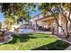 Spacious backyard featuring mature trees and a pool, providing a serene outdoor living space at 474 E Baylor Ln, Gilbert, AZ 85296