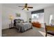 Bedroom with natural light and a ceiling fan, providing a cozy and relaxing ambiance at 474 E Baylor Ln, Gilbert, AZ 85296