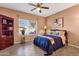 Cozy bedroom featuring natural light and a ceiling fan at 474 E Baylor Ln, Gilbert, AZ 85296