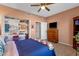 Cozy bedroom with ceiling fan, tiled floor, and closet at 474 E Baylor Ln, Gilbert, AZ 85296