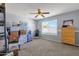 Bedroom featuring a ceiling fan, carpet, and a large window allowing for lots of natural light at 474 E Baylor Ln, Gilbert, AZ 85296