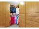 Walk-in closet features custom shelving, providing plenty of storage space at 474 E Baylor Ln, Gilbert, AZ 85296