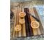 A beautiful wood cutting board holds four halved grapefruit and a knife in the image at 474 E Baylor Ln, Gilbert, AZ 85296