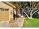 Welcoming front entrance with decorative iron gate, lush landscaping, and a cozy pathway at 474 E Baylor Ln, Gilbert, AZ 85296