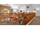 Second floor hallway with oak banister and chair lift at 474 E Baylor Ln, Gilbert, AZ 85296