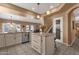 Spacious kitchen with an island with bar stool seating, pendant lighting, and lots of room to prep and cook at 474 E Baylor Ln, Gilbert, AZ 85296