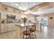 Bright, open kitchen showcasing granite countertops, an island with seating, and a seamless flow to the dining area at 474 E Baylor Ln, Gilbert, AZ 85296