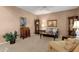 Inviting living room featuring neutral walls, plush carpeting, and comfortable seating arrangements at 474 E Baylor Ln, Gilbert, AZ 85296