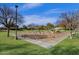 Community playground with swings and various play structures at 474 E Baylor Ln, Gilbert, AZ 85296