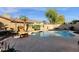 Backyard pool surrounded by desert landscaping and privacy wall at 474 E Baylor Ln, Gilbert, AZ 85296