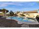 Large backyard pool and patio area with desert landscaping and privacy wall at 474 E Baylor Ln, Gilbert, AZ 85296