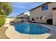 Spacious backyard with a refreshing in-ground pool and two-story house at 474 E Baylor Ln, Gilbert, AZ 85296