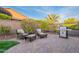 The brick patio features a seating area and grill, perfect for outdoor entertaining and dining at 518 E Laddoos Ave, Queen Creek, AZ 85140