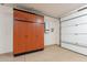 Organized garage featuring custom cabinets and epoxy flooring, offering a clean and efficient space at 518 E Laddoos Ave, Queen Creek, AZ 85140