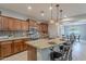 Elegant kitchen featuring granite countertops, a central island with seating, stainless steel appliances, and ample cabinetry at 518 E Laddoos Ave, Queen Creek, AZ 85140