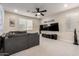 Upstairs bonus room is complete with recessed lighting, ceiling fan and large television at 5281 S Red Rock St, Gilbert, AZ 85298