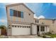 Charming two-story home featuring a two-car garage, landscaped front yard, and stylish architectural details at 5281 S Red Rock St, Gilbert, AZ 85298