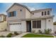 Charming two-story home featuring a two-car garage, landscaped front yard, and stylish architectural details at 5281 S Red Rock St, Gilbert, AZ 85298