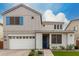 Charming two-story home featuring a two-car garage, landscaped front yard, and stylish architectural details at 5281 S Red Rock St, Gilbert, AZ 85298