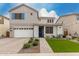 Charming two-story home featuring a two-car garage, landscaped front yard, and stylish architectural details at 5281 S Red Rock St, Gilbert, AZ 85298