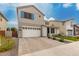 Charming two-story home featuring a two-car garage, landscaped front yard, and stylish architectural details at 5281 S Red Rock St, Gilbert, AZ 85298